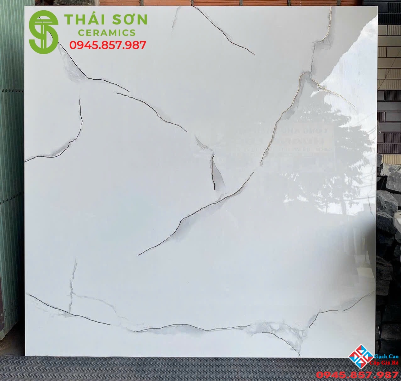 Gạch trung quốc 100x100 đá đồng chất trắng khắc kim