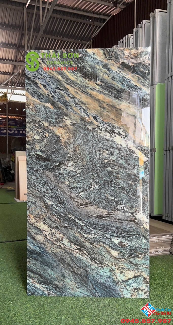 Gạch bóng kiếng 60x120 lát nền catalan vân xanh ngọc pha xám đen