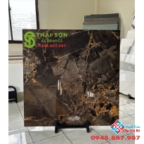 Gạch trung quốc 100x100 xám nâu đường chỉ màu vàng đồng