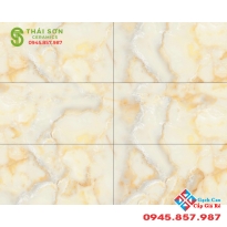 Gạch trung quốc cao cấp 40x80 vân đá vàng dán vách nhà phố đẹp