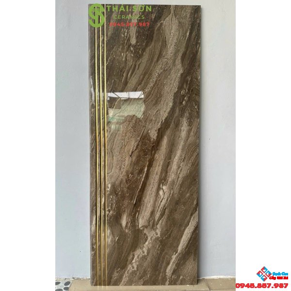 Gạch cầu thang 47x120 trung quốc màu nâu khắc kim vàng