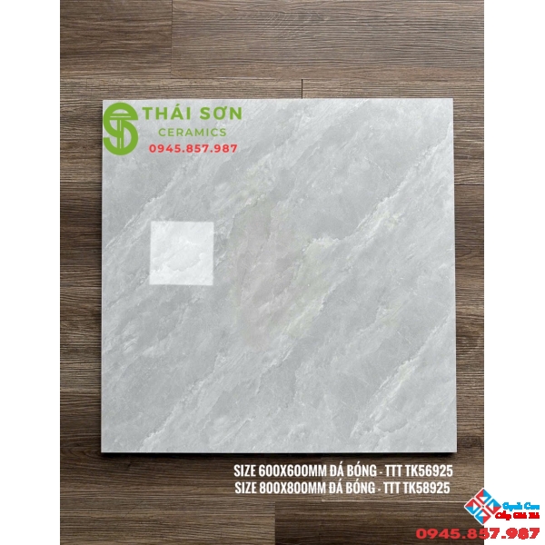 Gạch Takao bóng kiếng 60x60 xám vân lát nền phòng khách